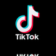 An image of TikTok's logo, which is also reflected at the bottom, is shown.